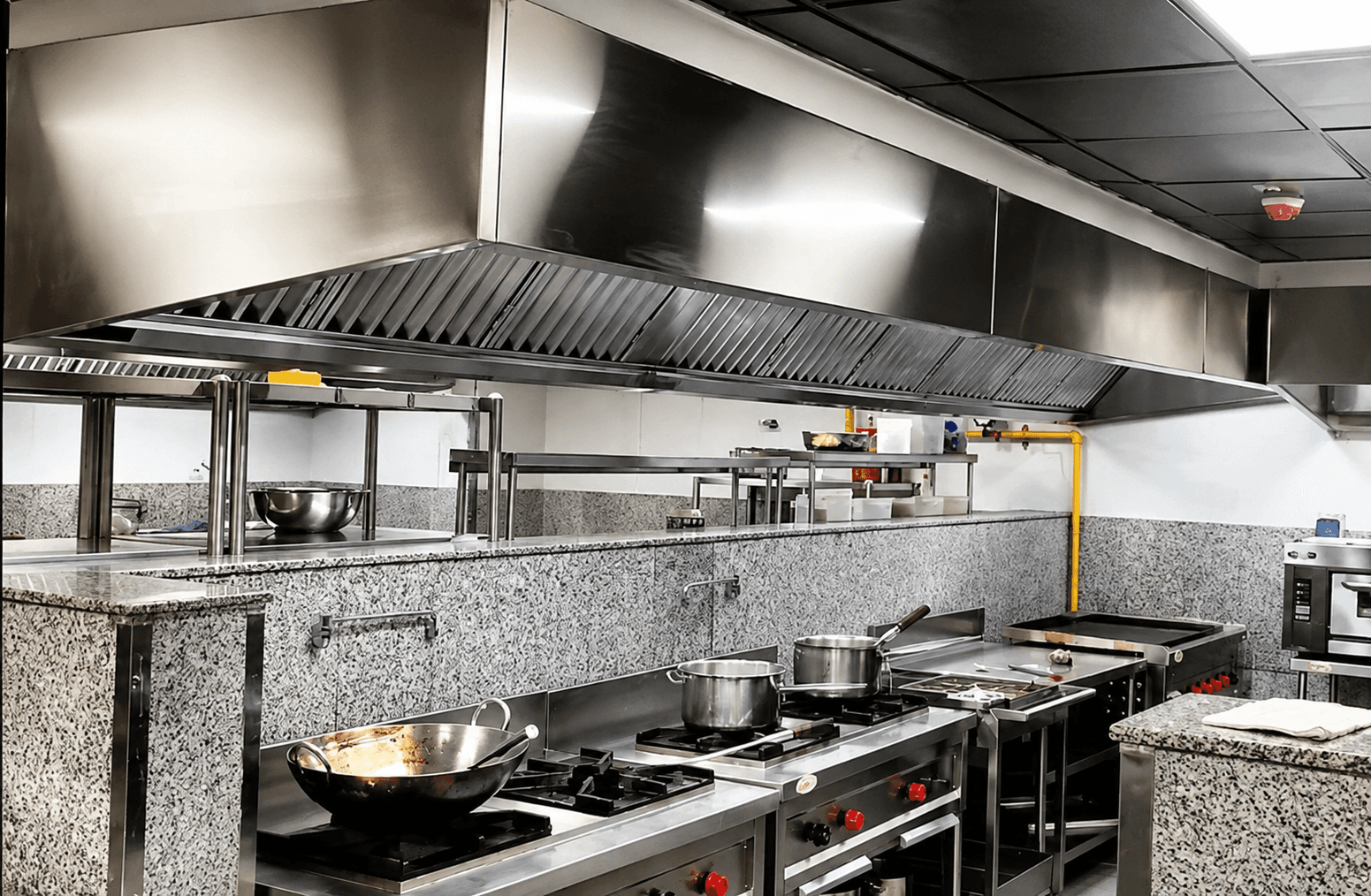 Commercial kitchen interior with stainless steel appliances